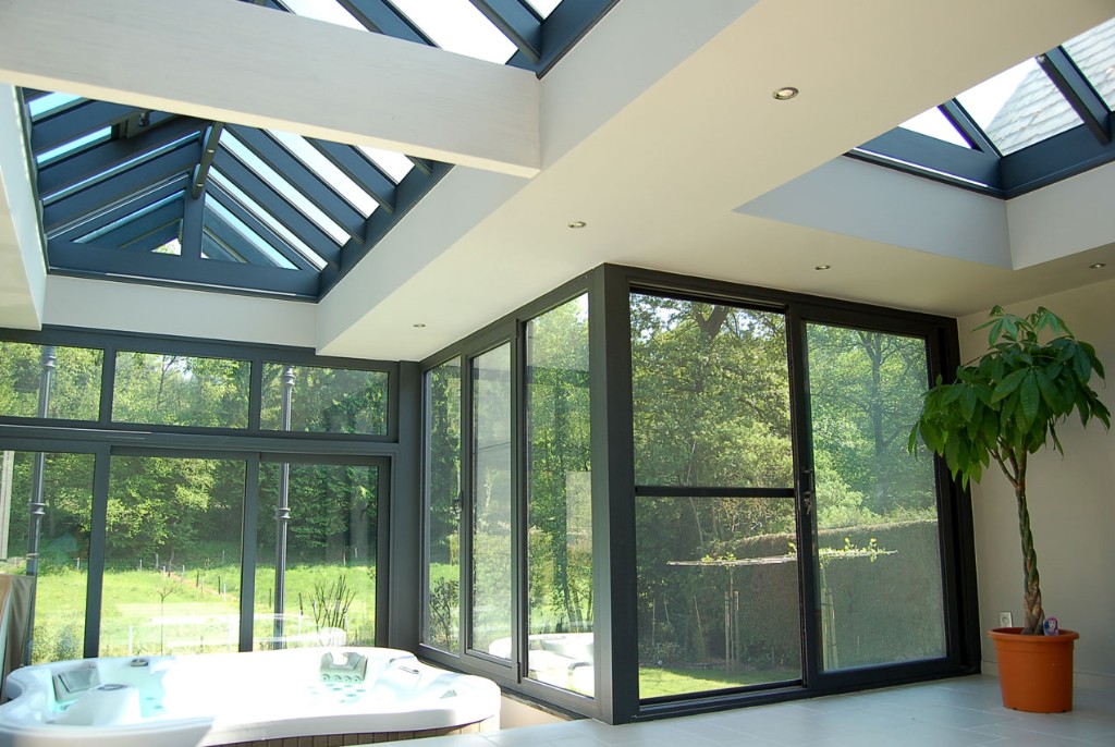 Glass sunroom with skylights and floor-to-ceiling joinery