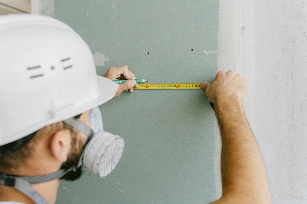 Measuring drywall during interior renovation