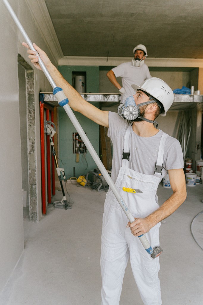 Ceiling sanding with stilts and scaffolding